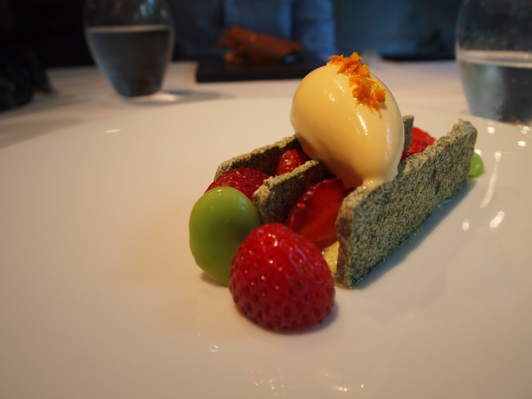 Green tea meringue with strawberries and fava beans